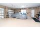 Spacious garage with epoxy flooring, storage shelves, and room for multiple vehicles at 14010 San Domingo Blvd, Port Charlotte, FL 33981