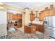Kitchen features granite counters, stainless appliances, custom cabinets, and center island with storage at 14010 San Domingo Blvd, Port Charlotte, FL 33981