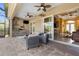 Inviting lanai with an outdoor kitchen, comfortable seating, and seamless indoor-outdoor flow at 14010 San Domingo Blvd, Port Charlotte, FL 33981