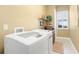 Laundry room with washer, dryer, and built-in shelving at 14010 San Domingo Blvd, Port Charlotte, FL 33981