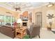 Stylish living room featuring a cozy fireplace, pool views, and comfortable seating at 14010 San Domingo Blvd, Port Charlotte, FL 33981
