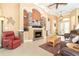 Comfortable living room with a stone fireplace, recessed lighting, and elegant decor at 14010 San Domingo Blvd, Port Charlotte, FL 33981
