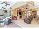 Indoor-outdoor living with a fireplace, outdoor grill, and seamless access to the living area at 14010 San Domingo Blvd, Port Charlotte, FL 33981