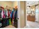 Large walk-in closet with shelving and hanging rods at 14010 San Domingo Blvd, Port Charlotte, FL 33981