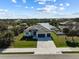 Single story home situated on a canal with surrounding neighborhood visible at 14681 Keystone Blvd, Port Charlotte, FL 33981