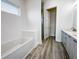 Relaxing bathroom with soaking tub, double vanity, and walk-in shower at 14681 Keystone Blvd, Port Charlotte, FL 33981