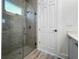 Modern bathroom with a glass shower and gray tile at 14681 Keystone Blvd, Port Charlotte, FL 33981