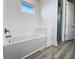 Clean bathroom with a soaking tub and walk-in shower at 14681 Keystone Blvd, Port Charlotte, FL 33981