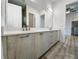 Modern bathroom with double vanity and light wood cabinets at 14681 Keystone Blvd, Port Charlotte, FL 33981