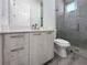 Clean bathroom with a white vanity and gray tile shower at 14681 Keystone Blvd, Port Charlotte, FL 33981