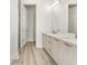 Elegant bathroom with double vanity, walk-in shower, and separate toilet at 14681 Keystone Blvd, Port Charlotte, FL 33981