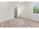 Bright bedroom with wood-look floors and a spacious closet at 14681 Keystone Blvd, Port Charlotte, FL 33981
