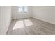 Bright bedroom with large window and wood-look flooring at 14681 Keystone Blvd, Port Charlotte, FL 33981