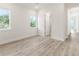Spacious bedroom with wood-look floors and an ensuite bathroom at 14681 Keystone Blvd, Port Charlotte, FL 33981