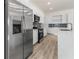 Modern kitchen with stainless steel appliances and white cabinetry at 14681 Keystone Blvd, Port Charlotte, FL 33981