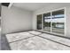 Spacious patio with sliding glass doors and gray pavers at 14681 Keystone Blvd, Port Charlotte, FL 33981