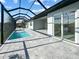 Lush pool area with patio and canal view at 14681 Keystone Blvd, Port Charlotte, FL 33981