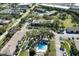 Community overview featuring building, pool, and ample parking at 1515 Forrest Nelson Blvd # A 202, Port Charlotte, FL 33952