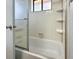 Clean bathroom with shower/tub combo and built-in shelving at 1515 Forrest Nelson Blvd # A 202, Port Charlotte, FL 33952