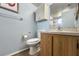 Bathroom features a toilet, sink vanity, and a mirrored medicine cabinet at 1515 Forrest Nelson Blvd # A 202, Port Charlotte, FL 33952