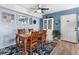 Dining area with wooden table and chairs, light blue walls at 1515 Forrest Nelson Blvd # A 202, Port Charlotte, FL 33952