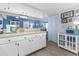 White kitchen cabinets and countertops, microwave, and view into living area at 1515 Forrest Nelson Blvd # A 202, Port Charlotte, FL 33952