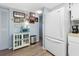White kitchen with refrigerator, counter space, and wood-look floors at 1515 Forrest Nelson Blvd # A 202, Port Charlotte, FL 33952