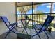 Screened porch with patio furniture, offering relaxing outdoor space at 1515 Forrest Nelson Blvd # A 202, Port Charlotte, FL 33952