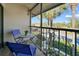 Relaxing screened balcony with patio furniture, offering a view of lush landscaping at 1515 Forrest Nelson Blvd # A 202, Port Charlotte, FL 33952