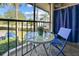 Enjoy your morning coffee on this screened balcony with small table and chairs at 1515 Forrest Nelson Blvd # A 202, Port Charlotte, FL 33952