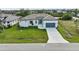Modern single story home with tile roof and attached garage at 15384 Hennipen Cir, Port Charlotte, FL 33981