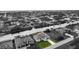 Aerial view of house and surrounding neighborhood by the canal at 15384 Hennipen Cir, Port Charlotte, FL 33981