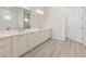 Elegant bathroom with double vanity and hardwood floors at 15384 Hennipen Cir, Port Charlotte, FL 33981