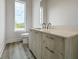 Modern bathroom with a vanity, toilet and window at 15384 Hennipen Cir, Port Charlotte, FL 33981