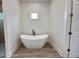 Modern bathroom featuring a freestanding bathtub at 15384 Hennipen Cir, Port Charlotte, FL 33981