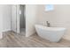 Relaxing bathroom with a large bathtub and shower at 15384 Hennipen Cir, Port Charlotte, FL 33981