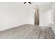 Large bedroom with hardwood floors and access to hallway at 15384 Hennipen Cir, Port Charlotte, FL 33981