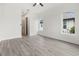 Spacious bedroom with two windows and hardwood floors at 15384 Hennipen Cir, Port Charlotte, FL 33981