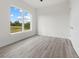 Spacious bedroom with large window and vinyl flooring at 15384 Hennipen Cir, Port Charlotte, FL 33981