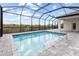 Inviting screened-in pool and patio area at 15384 Hennipen Cir, Port Charlotte, FL 33981