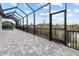 Large pool deck with screened enclosure at 15384 Hennipen Cir, Port Charlotte, FL 33981