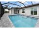 Enjoy this refreshing screened-in pool at 15384 Hennipen Cir, Port Charlotte, FL 33981