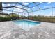 Relaxing screened-in pool with paver deck at 15384 Hennipen Cir, Port Charlotte, FL 33981