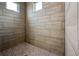 Spacious shower with tile surround and multiple windows at 15384 Hennipen Cir, Port Charlotte, FL 33981