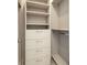 Bright walk-in closet with shelves, drawers and hanging rods at 15384 Hennipen Cir, Port Charlotte, FL 33981