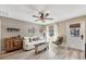 Bright living room featuring a comfy sofa and wood-look floors at 1570 Virginia Ln, Englewood, FL 34223