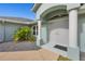 Double door entry with decorative columns and lush landscaping at 15832 Hennipen Cir, Port Charlotte, FL 33981