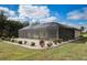 Relaxing pool area with screened enclosure and landscaping at 166 Rotonda N Blvd, Rotonda West, FL 33947