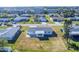 Aerial view of a single-Gathering home with a large backyard and surrounding neighborhood at 1740 Elinor Pl, Englewood, FL 34223