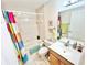 Bathroom with shower/tub combo and colorful shower curtain at 175 Kings Hwy # 234, Punta Gorda, FL 33983